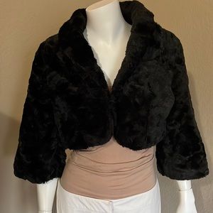 Black faux fur cropped jacket.